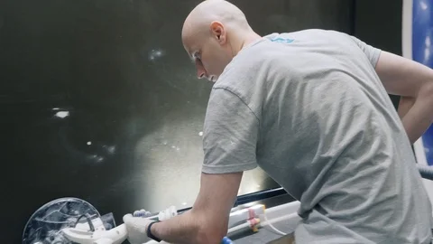 Guy does repairing flat using grinder with vacuum cleaner Stock Footage 124299344