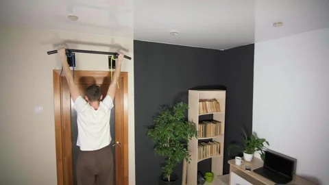 The guy does sports at home Stock Footage 264096660