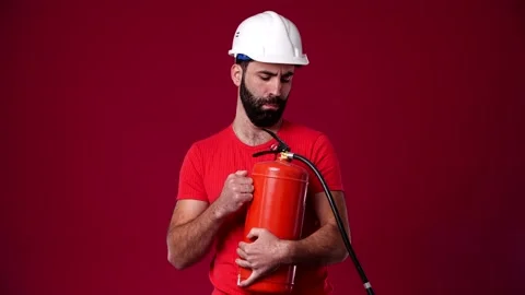 The guy doesn't know how to use a fire extinguisher Stock Footage 165621579