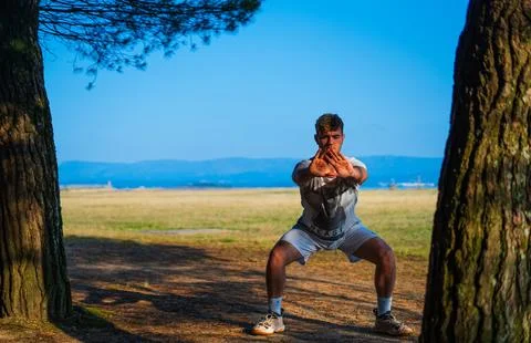 Guy doing stand up meditation Stock Photos