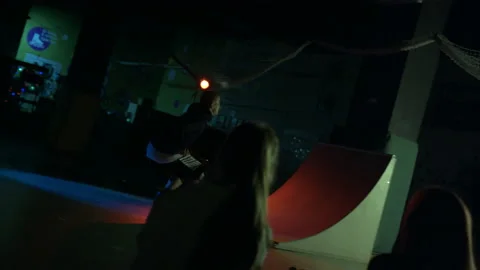 Guy doing stunt roller-skating. Teenager jump on ramp and bouncing off the wall Stock Footage 157542425