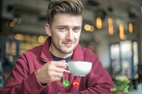 Guy doing a video call while drinking coffee Stock Photos