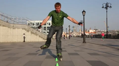 Guy doing a virtuoso tricks on roller skates Stock Footage 63363651