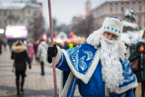A guy dressed as Santa Claus posing on the street Stock Photos