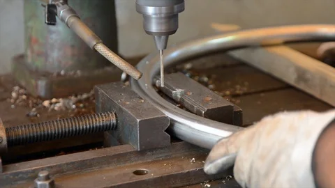 Guy drilling with an industrial drill press Stock Footage 127658330