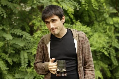 Guy is  drinking beer from a glass Stock Photos