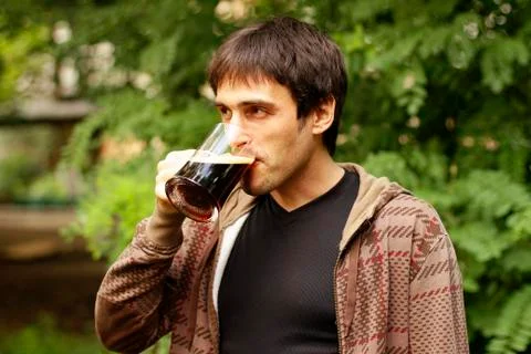 Guy is drinking a beer Stock Photos