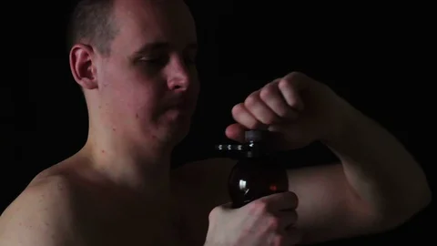 Guy drinking beer from a plastic bottle Stock Footage 73712940