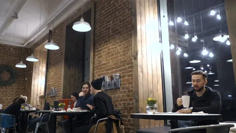 Guy is drinking coffee in cafe Stock Footage 86393470