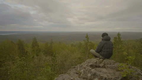 Guy is drinking tea in the forest Stock Footage 91193195