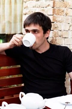 Guy is drinking tea  Stock Photos