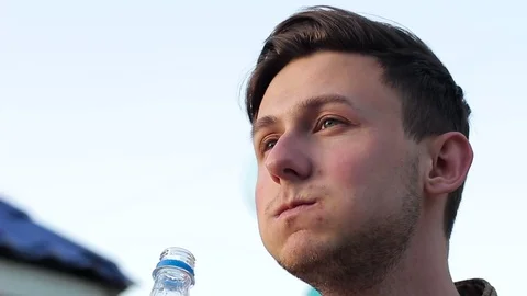 A guy drinking water. Close-up Stock Footage 75082954