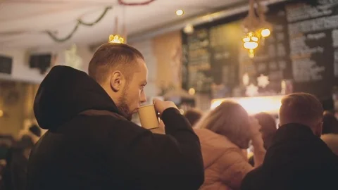 The guy drinks coffee while in an institution Stock Footage 76611456