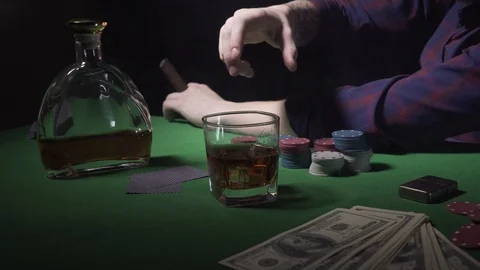 Guy drinks whiskey at the casino Stock Footage 123658422