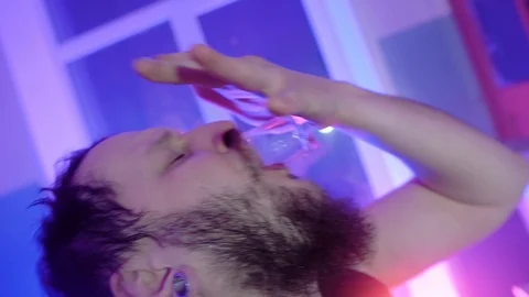The guy drinks whiskey, leaning a mortar, a map Stock Footage 125356233