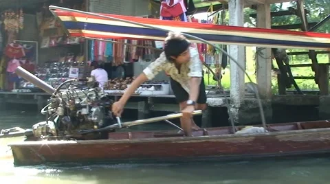 Guy drive longtail. Thai floating boat market at khlong canal. Thailand Stock Footage 52218221