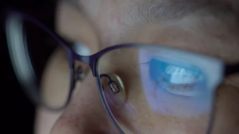A guy of Eastern appearance with glasses in front of the monitor. Stock Footage 129421946