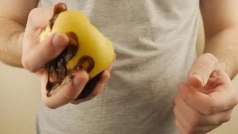 Guy Eating An Apple Covered In Dirty Chocolate Stock Footage 151218892