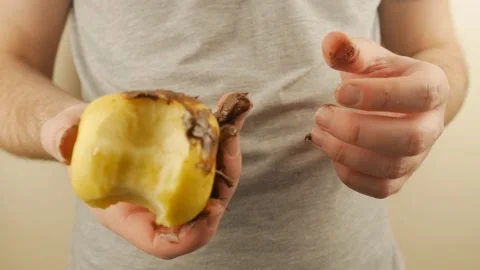 Guy Eating An Apple Covered In Dirty Chocolate Stock-Footage 151218896