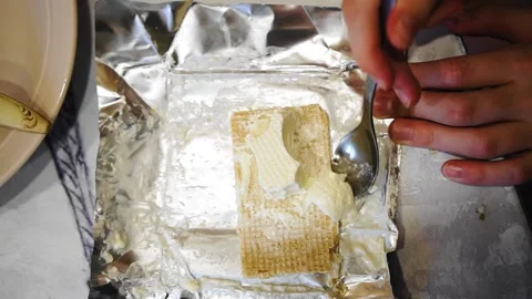 The guy is eating ice cream with waffles on the table Stock Footage 323457869