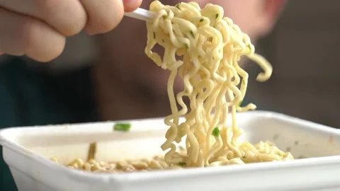 The guy eating noodles Stock Footage 131771544
