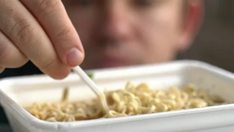 The guy eating noodles Stock Footage 131771592