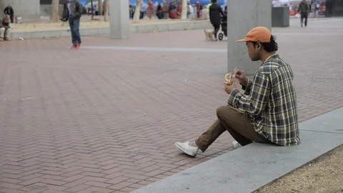 Guy Eating A Sandwich Video stock 121164697