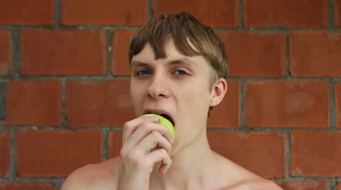 Guy Eats Apple Stock Footage 8659436