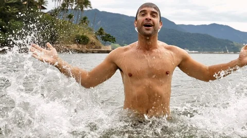 Guy emerging from sea Stock Footage 93995559