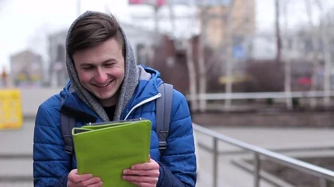 The guy emotionally communicates Skype. He uses a tablet Stock Footage 73462945