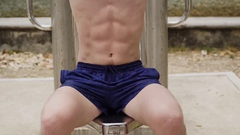 The guy is engaged in street exercise equipment 스톡 동영상 120050160