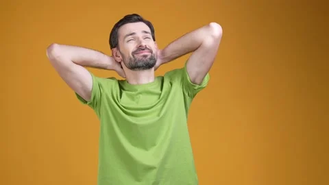 Guy enjoy free time rest after work day relax isolated bright color background Stock Footage 204988934