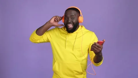 Guy enjoy headset stereo sound dance device isolated vivid color background Stock Footage 168309363