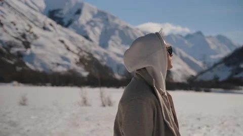 The guy enjoys the view of the mountains Stock Footage 169811536