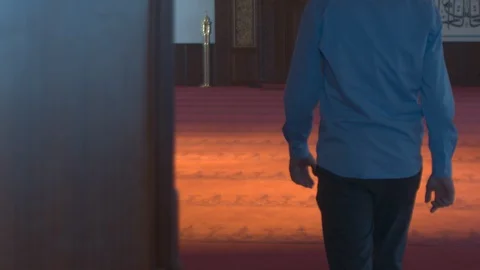 Guy entering empty mosque Stock Footage 88044153