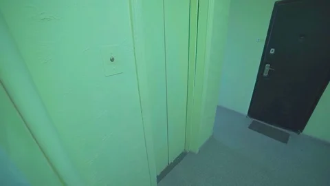 Guy enters the soviet old dark elevator, leaves the elevator. point of view Stock Footage 129552976