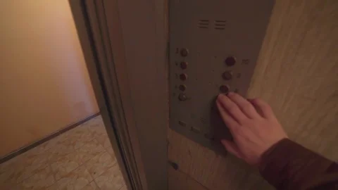 Guy enters the soviet old dark elevator, leaves the elevator. point of view Stock Footage 129553140