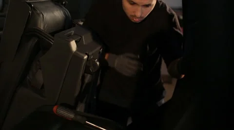 The guy examines the car for noise insulation Stock Footage 56023986
