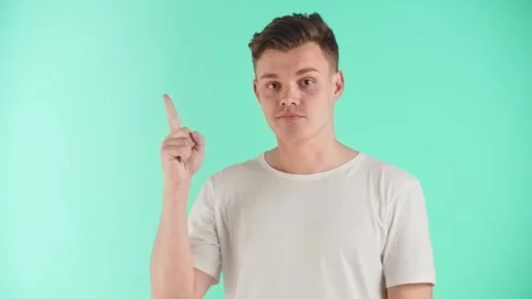 The guy expresses emotions of satisfaction, joy and confidence after thinking Stock Footage 251381730