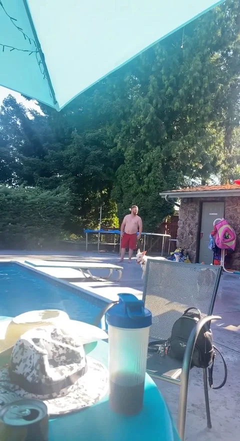 Guy Fails Doing Cartwheel into Pool, Surrey, British Columbia, Canada - 11 Aug 2 Video stock 205435406
