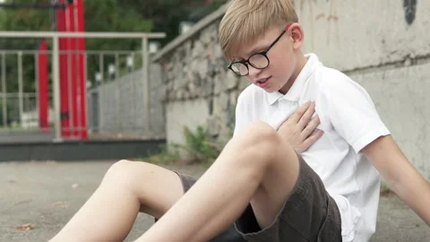 The guy feels a sharp pain in the heart during training outside. Stock Footage 288330282