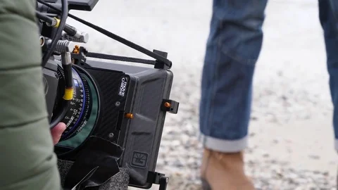 Guy filming professional video at the beach  Stock Footage 85375420