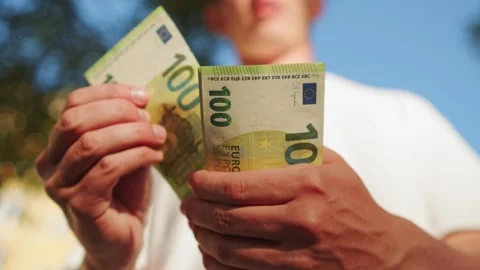 Guy flipping through a handful of 100 bills, money concept. Stock Footage 335652940