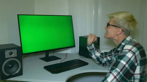 Guy is fooling around and threatening with his fist at the screen. Stock Footage 204946176