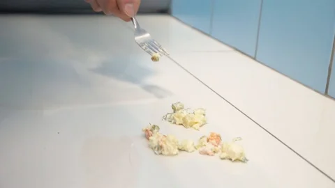 The guy with the fork in his hand dropped the salad next to the toilet Stock Footage 123348068
