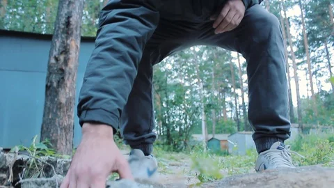 The guy found the phone among the rocks Stock Footage 113859344