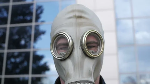 The guy in the gas mask shows gestures with his hands. Protection concept Stock Footage 127040486