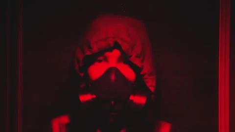The guy in the gas mask turned on the panic button and went out of hiding Stock Footage 102390748