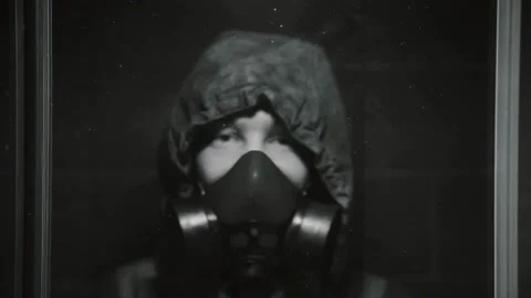 The guy in the gas mask turned on the panic button and went out of hiding Stock Footage 102392975