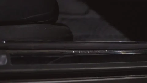 The guy gets into the car in the evening. Stock Footage 130738138